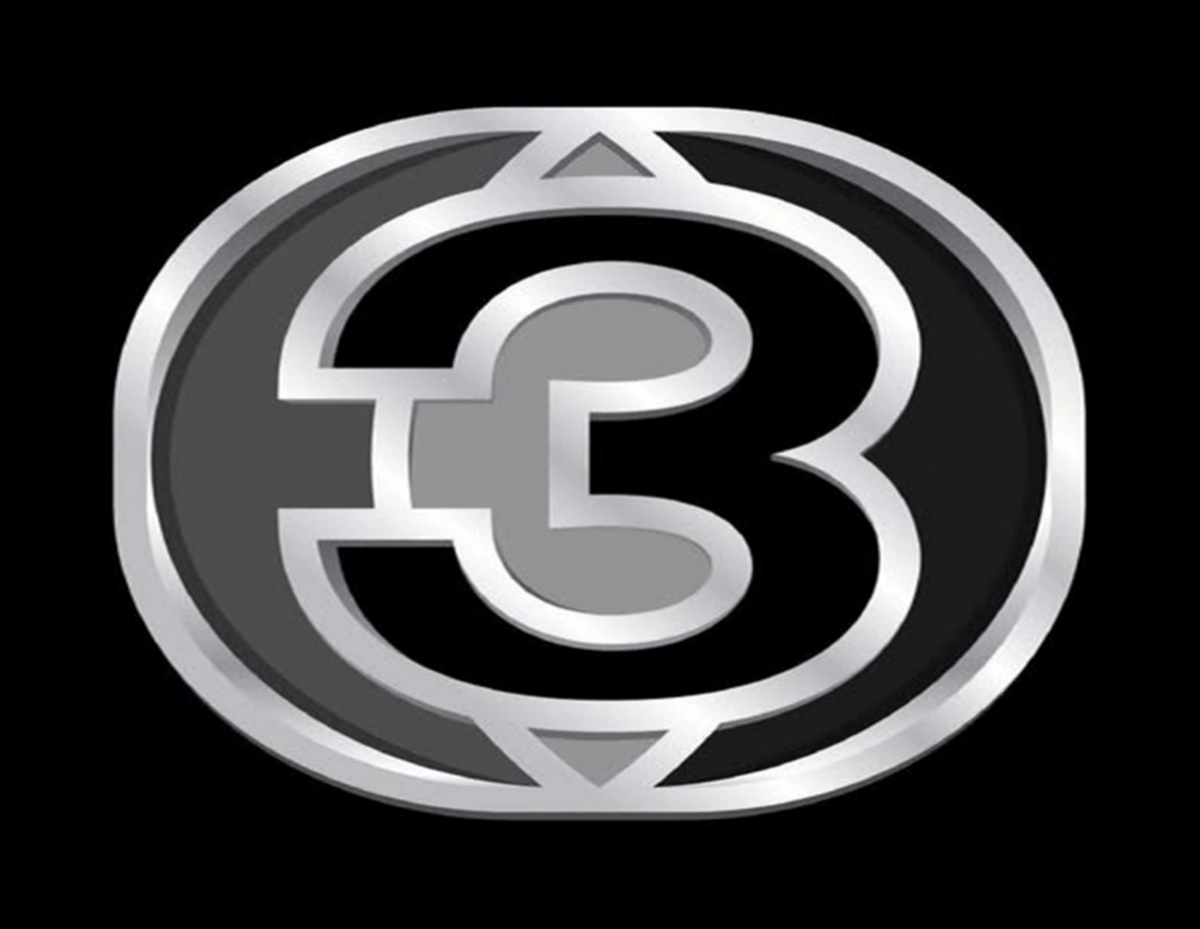 Metallic circular logo with a stylized 'E3' centerpiece on a black background.