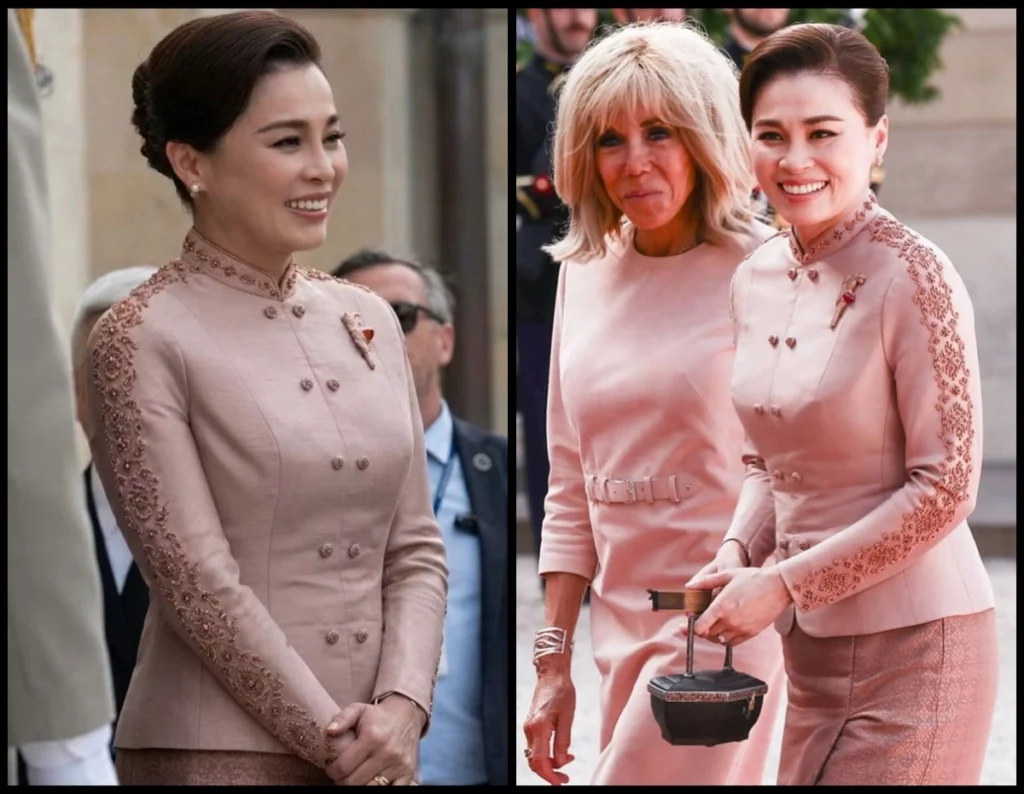 Two women in pale pink, embroidered dresses at a formal event, smiling; one stands on the left while two walk together on the right with a small box-like object